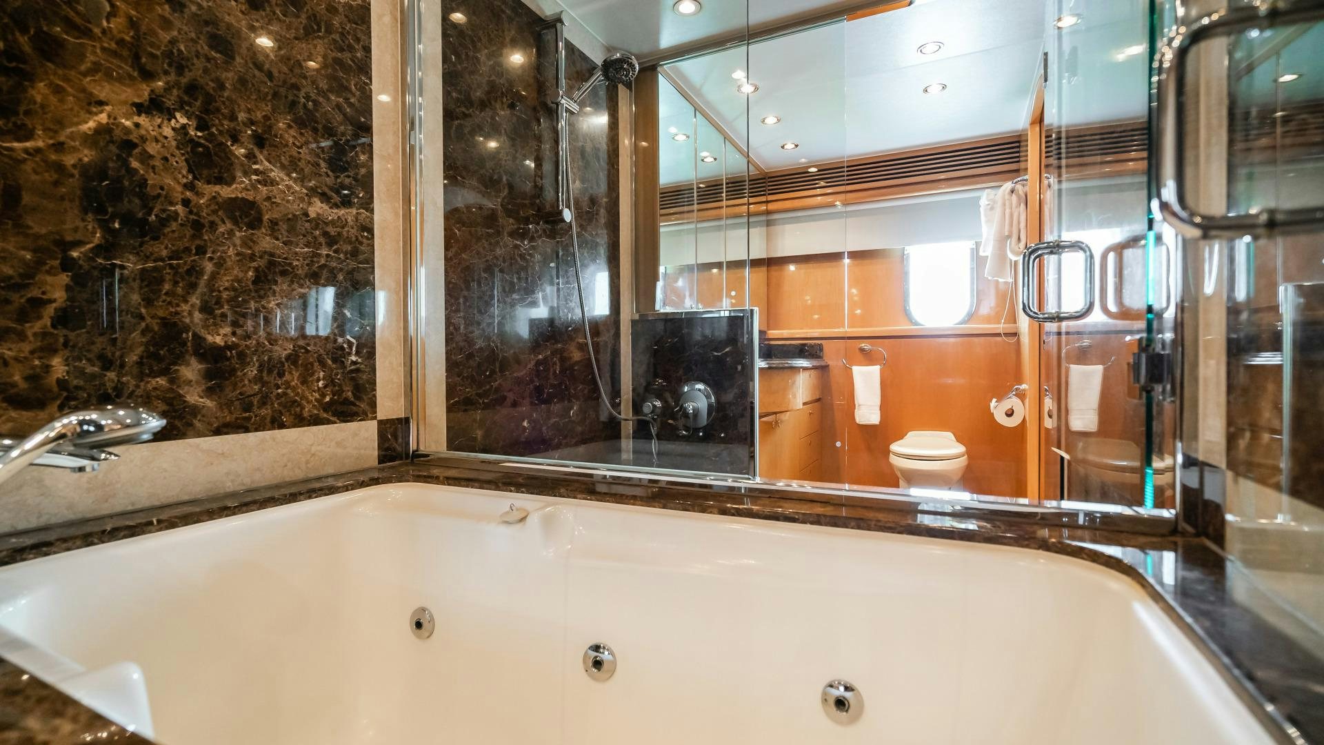 a large bathtub with a large mirror aboard VITESSE Yacht for Sale