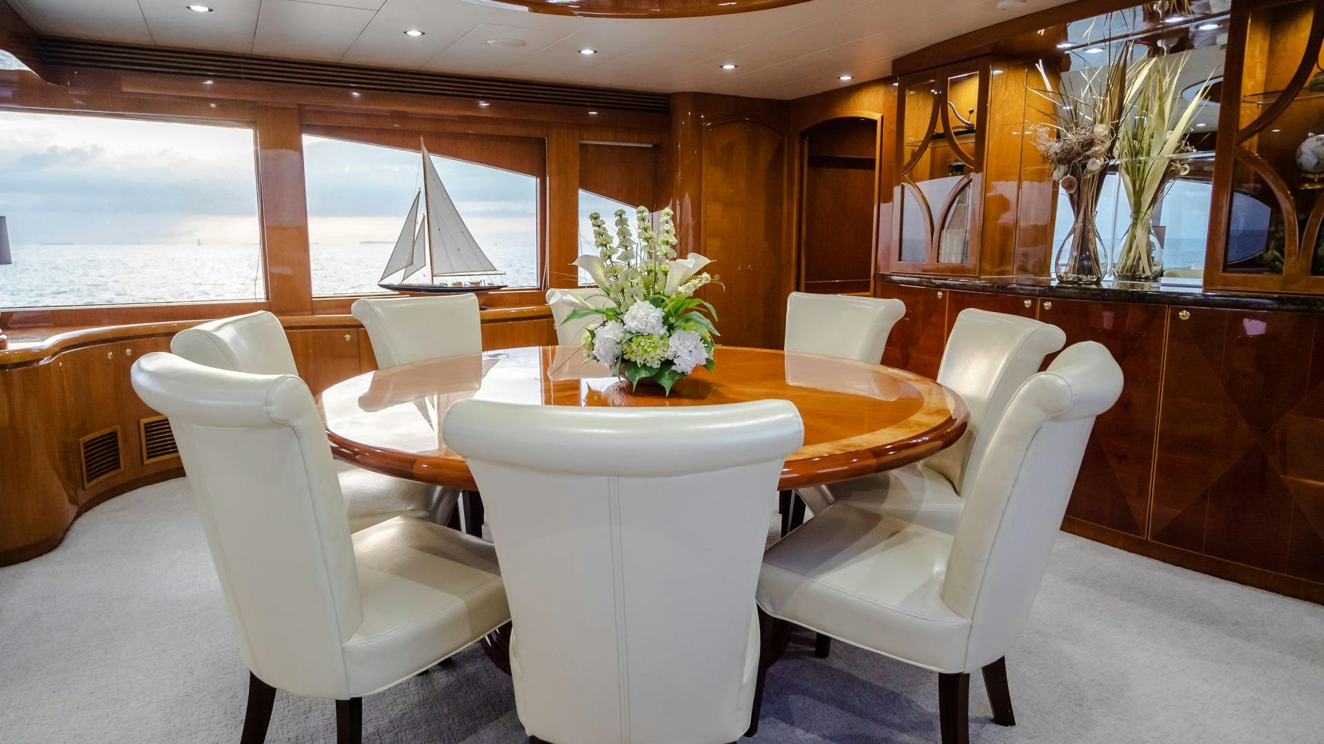 a room with a table and chairs aboard VITESSE Yacht for Sale