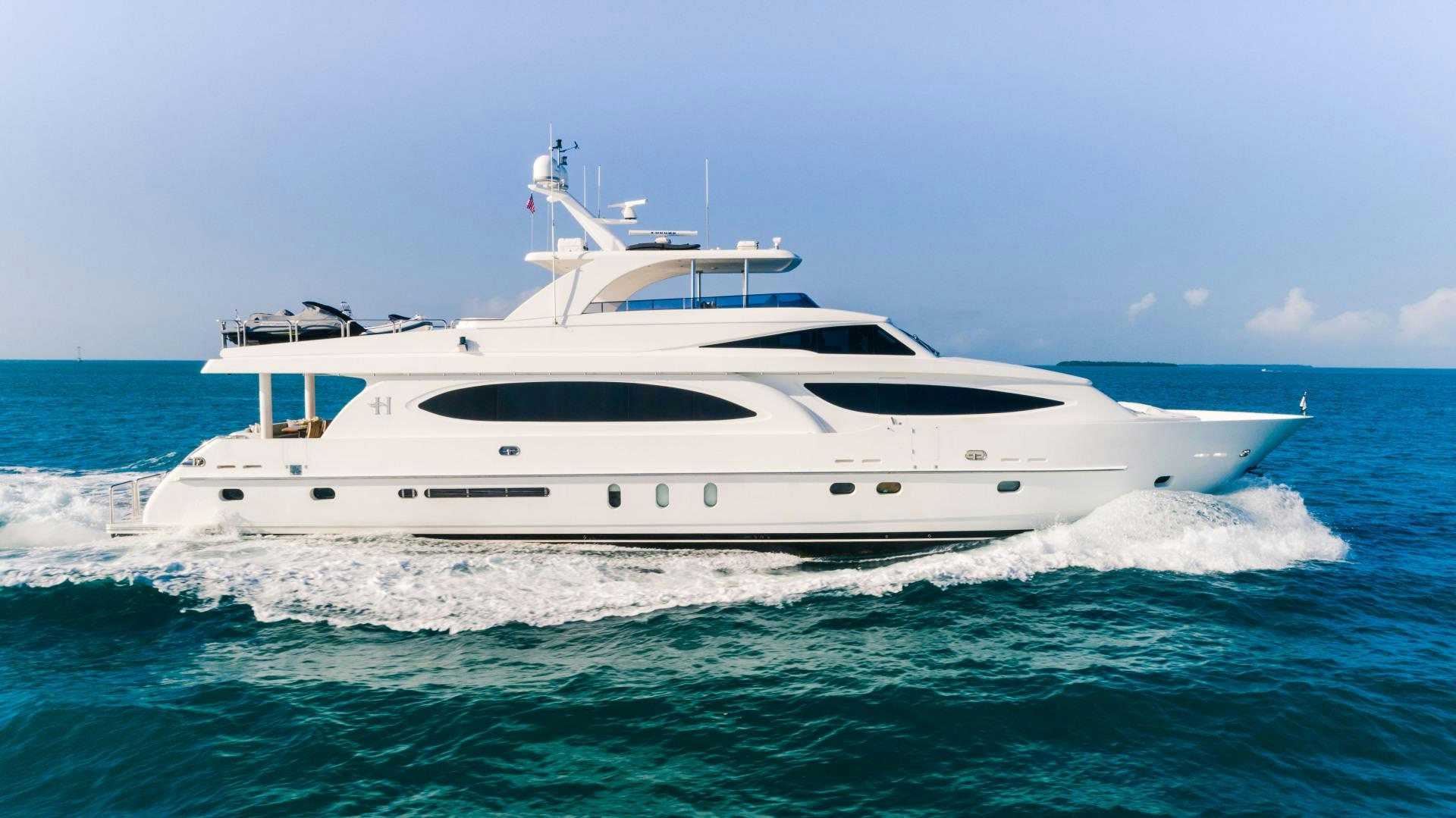 a white yacht in the ocean aboard VITESSE Yacht for Sale