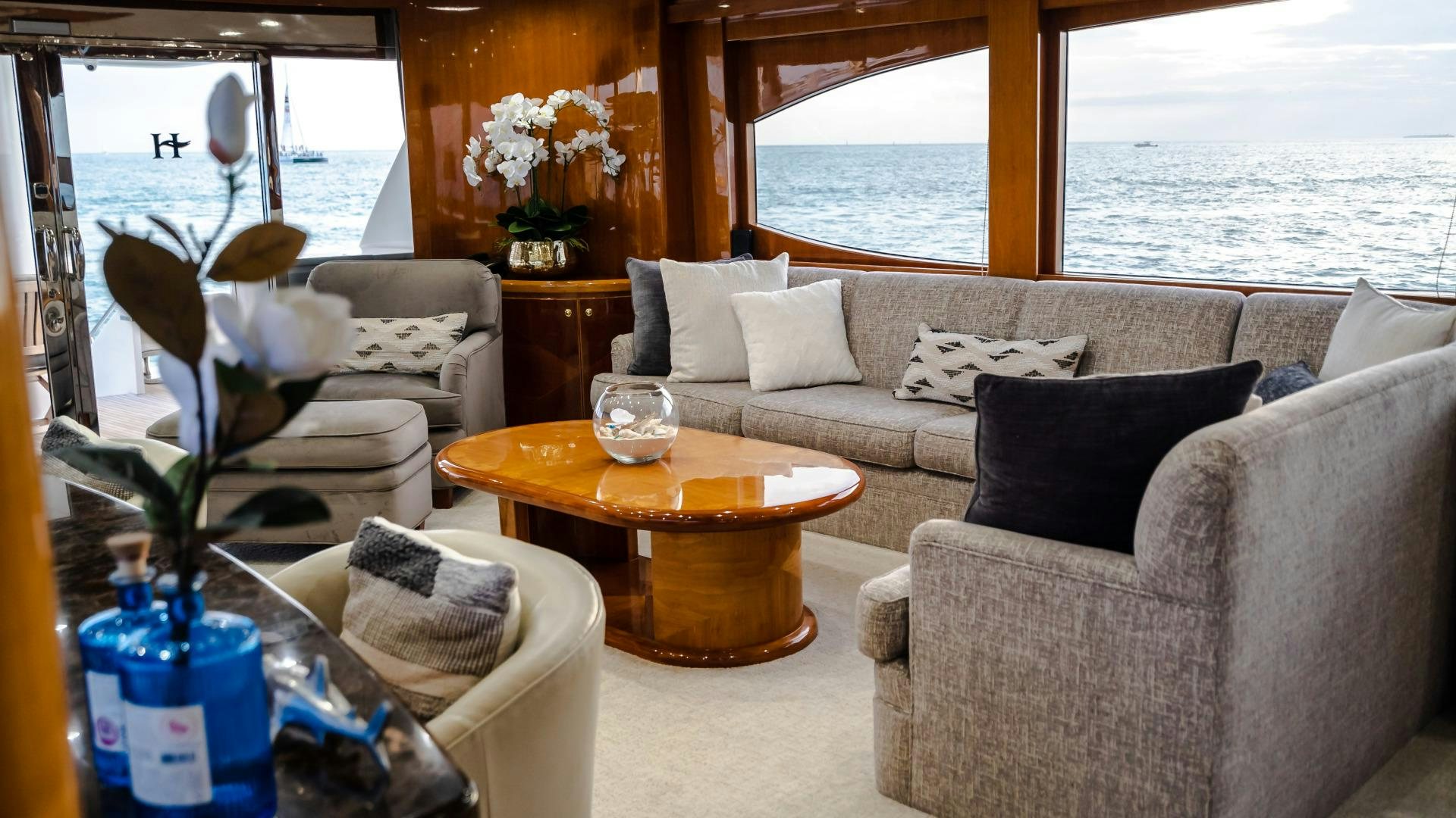 a living room with a table and chairs aboard VITESSE Yacht for Sale