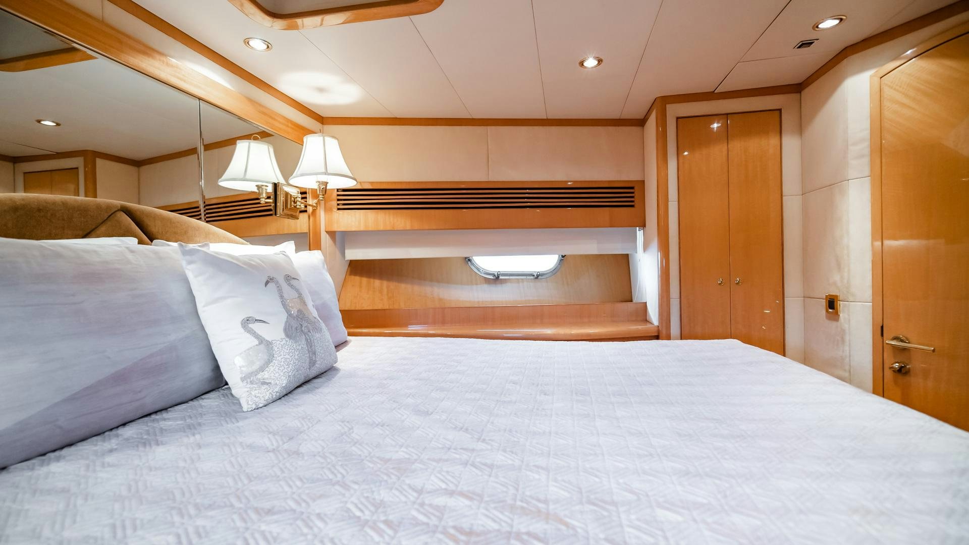 a bed with white sheets aboard VITESSE Yacht for Sale