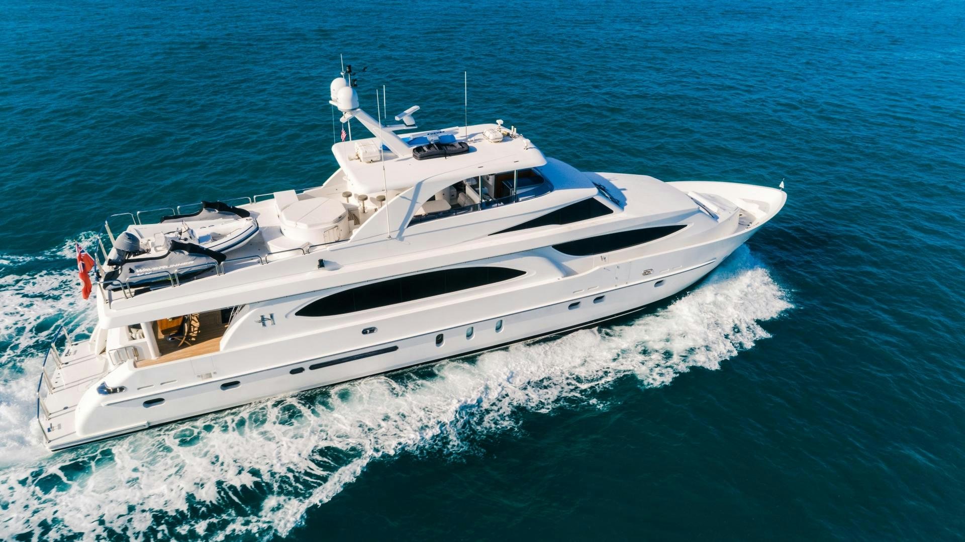 a white yacht on the water aboard VITESSE Yacht for Sale
