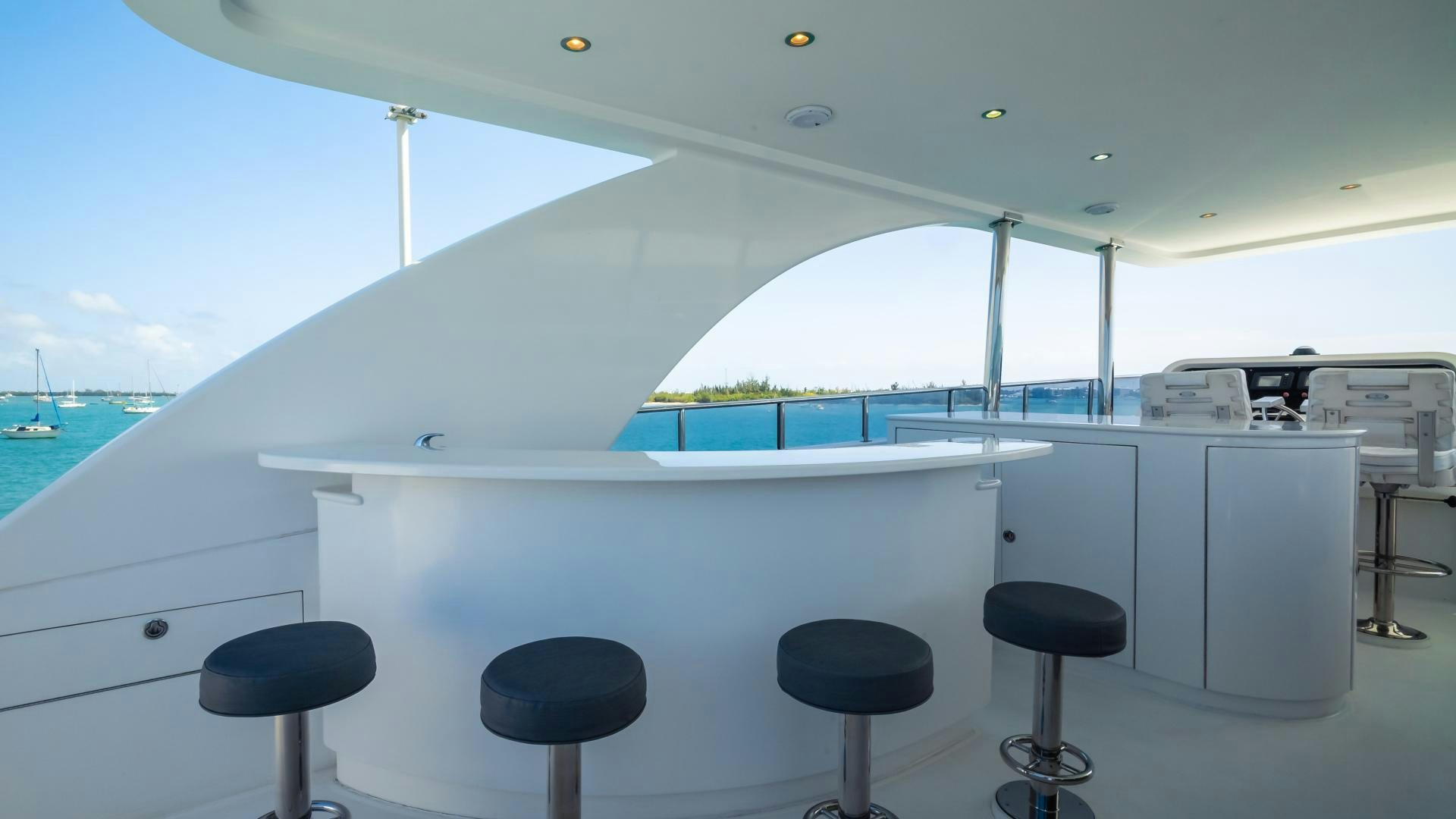 a white room with a desk and chairs and a large window aboard VITESSE Yacht for Sale