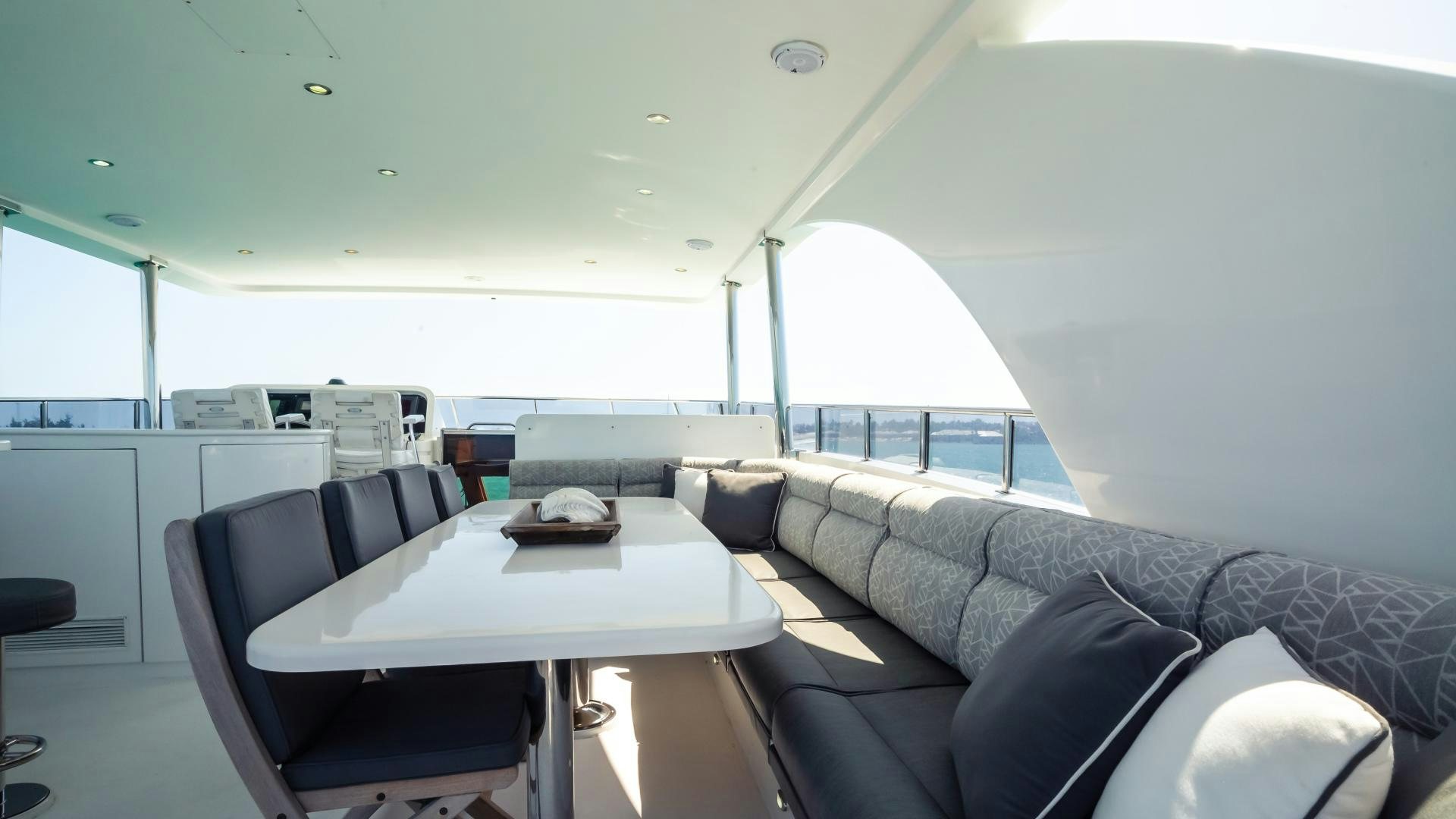 a room with a couch and a table aboard VITESSE Yacht for Sale