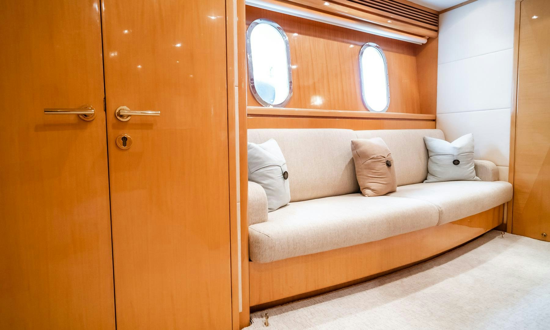 a couch in a room aboard VITESSE Yacht for Sale
