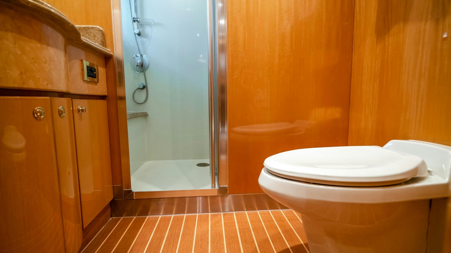 a bathroom with a glass shower aboard VITESSE Yacht for Sale