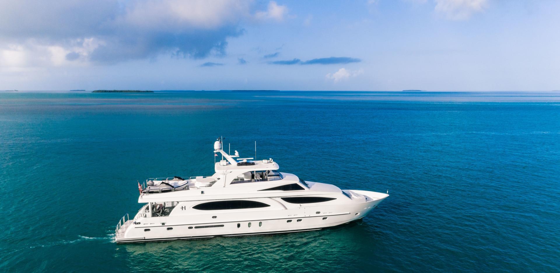 a white yacht in the ocean aboard VITESSE Yacht for Sale