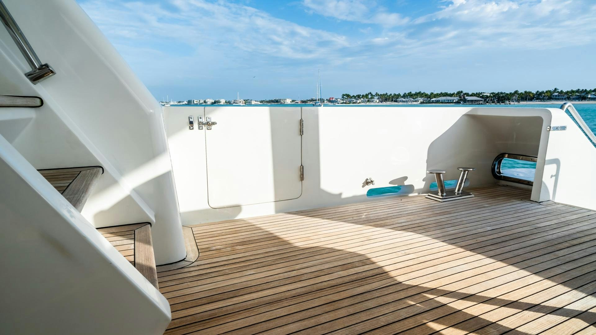 a room with a deck and a view of the water aboard VITESSE Yacht for Sale