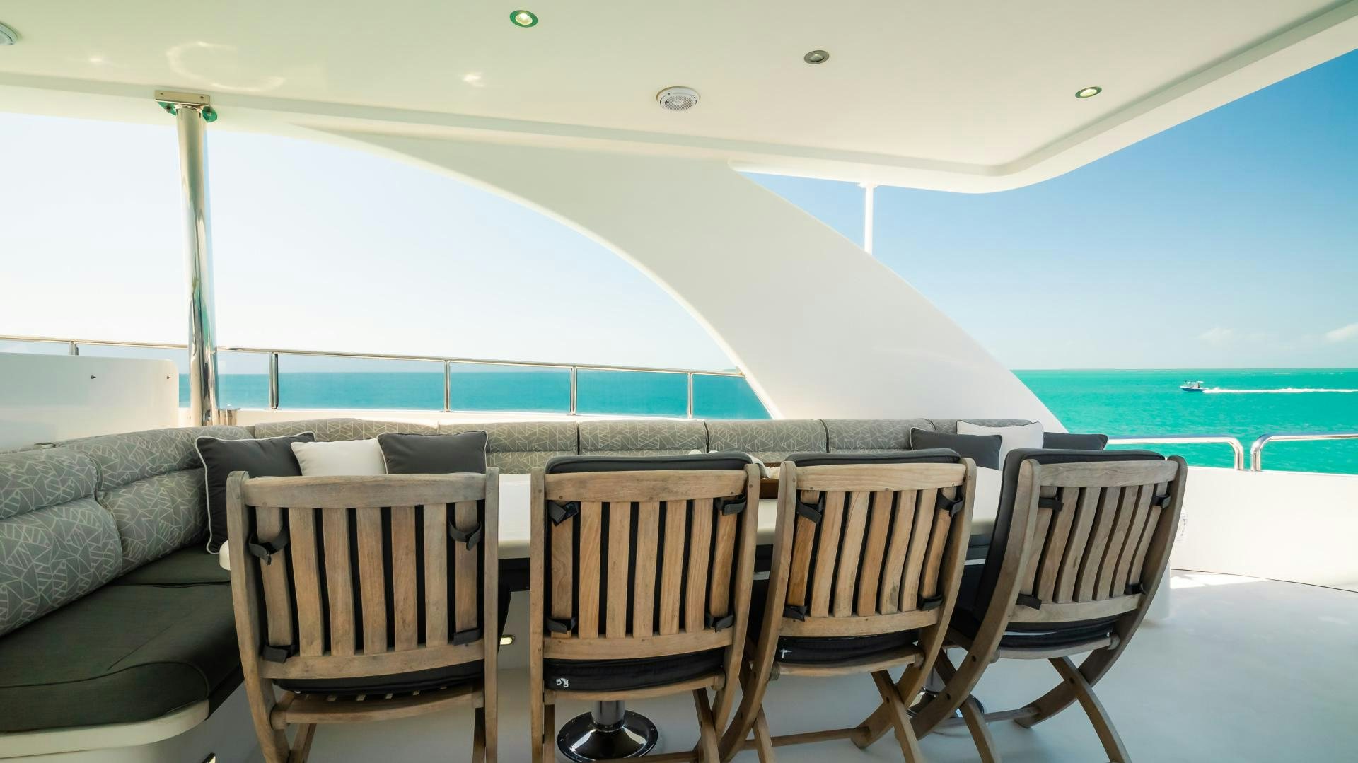 a table and chairs on a deck aboard VITESSE Yacht for Sale