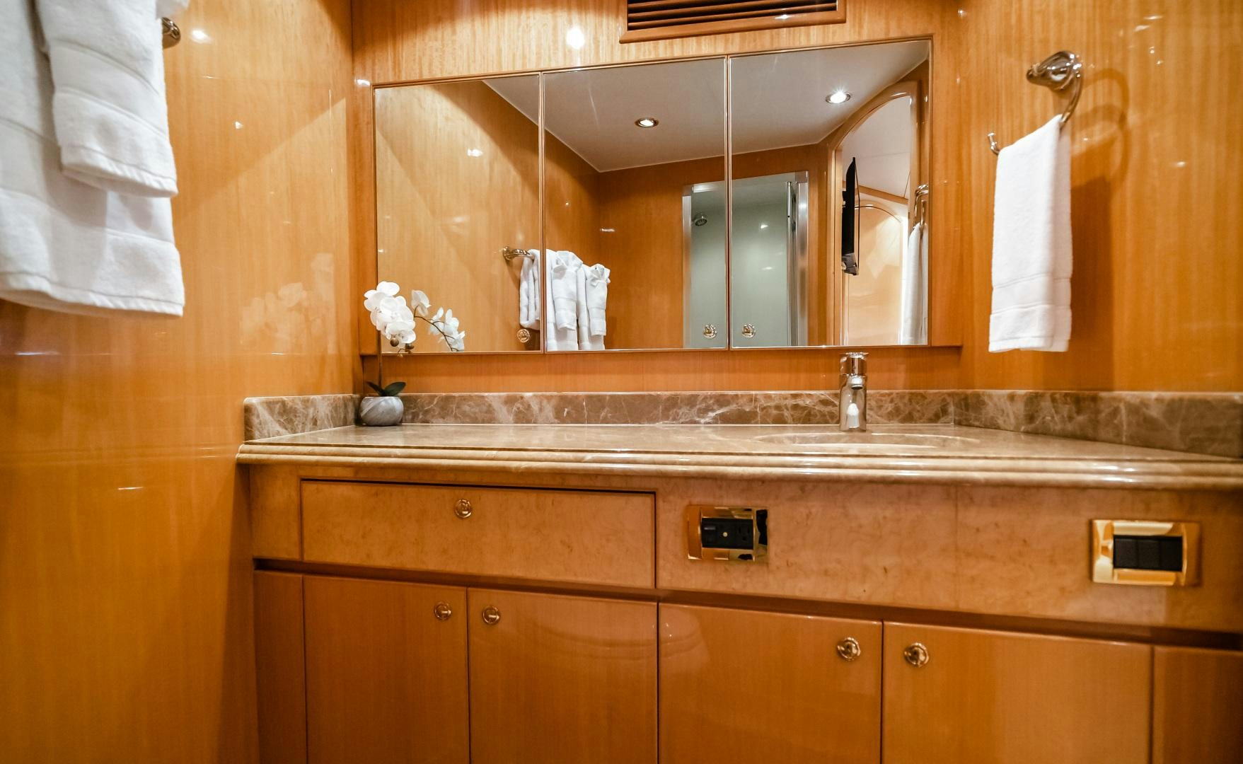 a bathroom with a large mirror aboard VITESSE Yacht for Sale