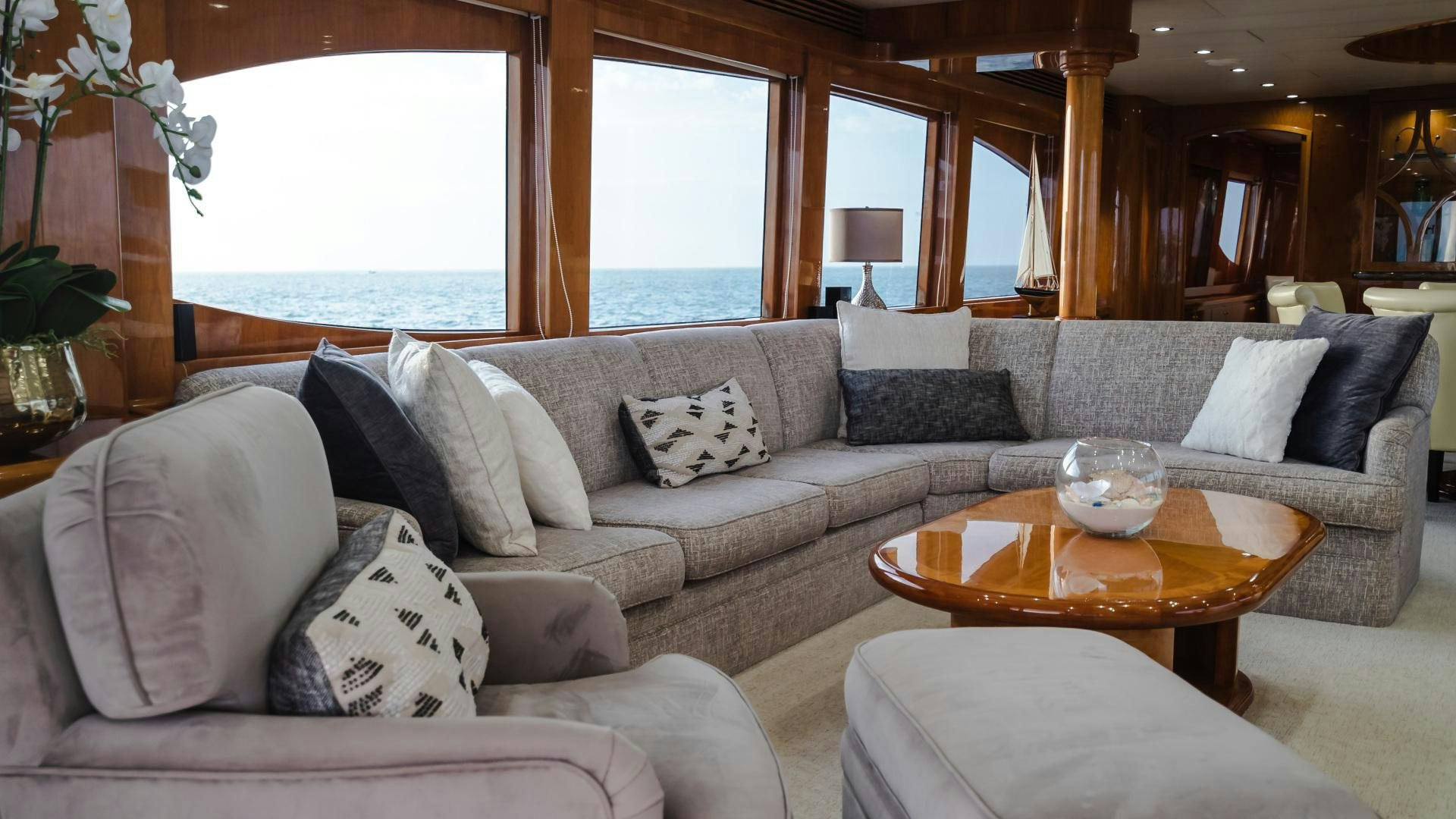 a living room with a couch and a coffee table aboard VITESSE Yacht for Sale