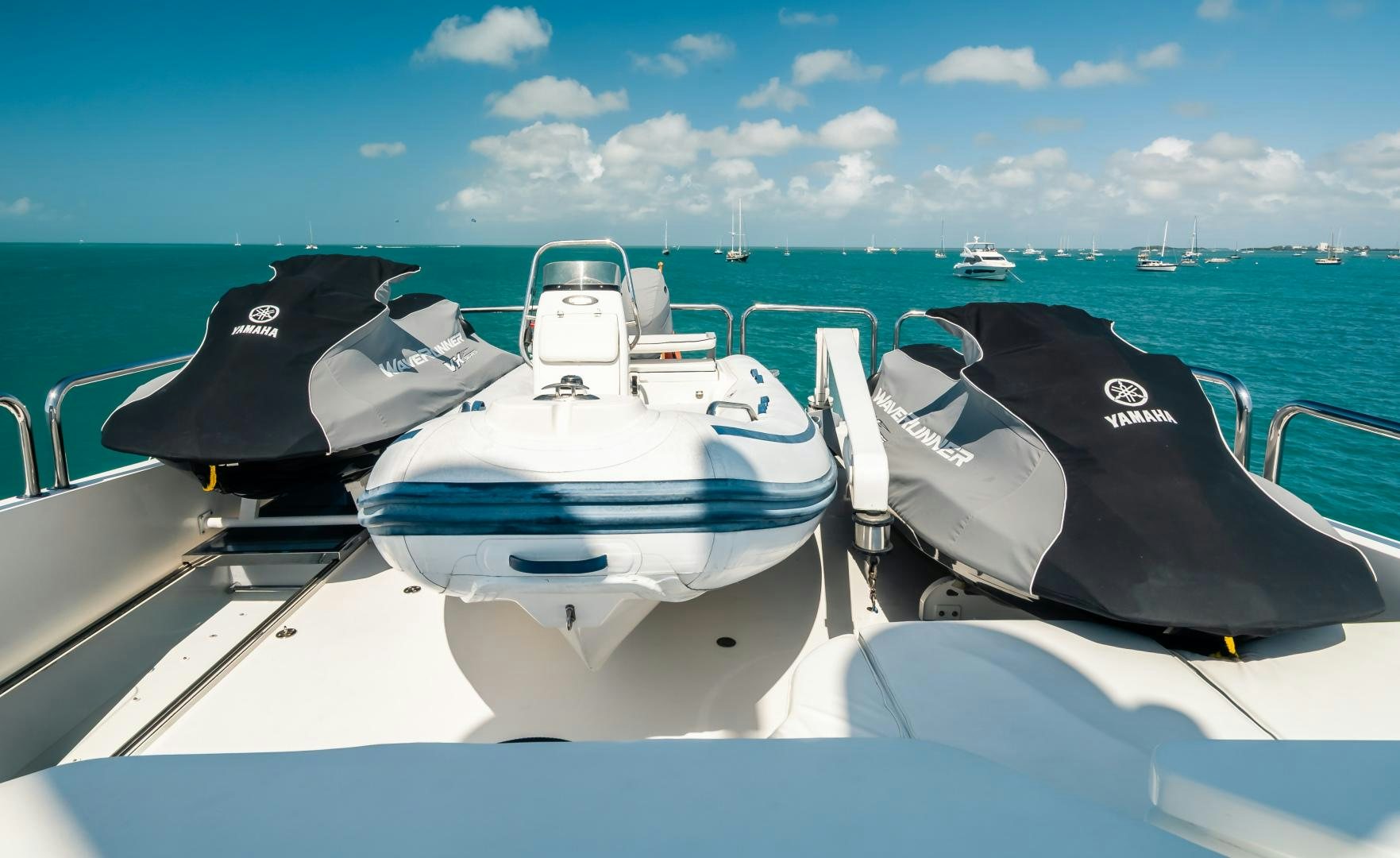 a white boat with a black seat on a boat in the water aboard VITESSE Yacht for Sale