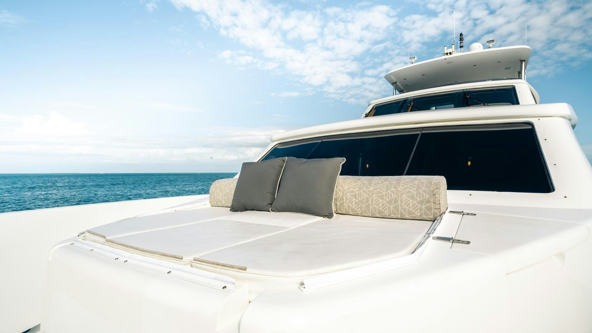 a white yacht on a blue sea aboard VITESSE Yacht for Sale