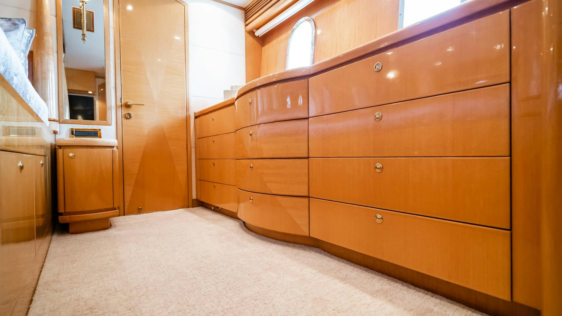 a room with wooden cabinets aboard VITESSE Yacht for Sale