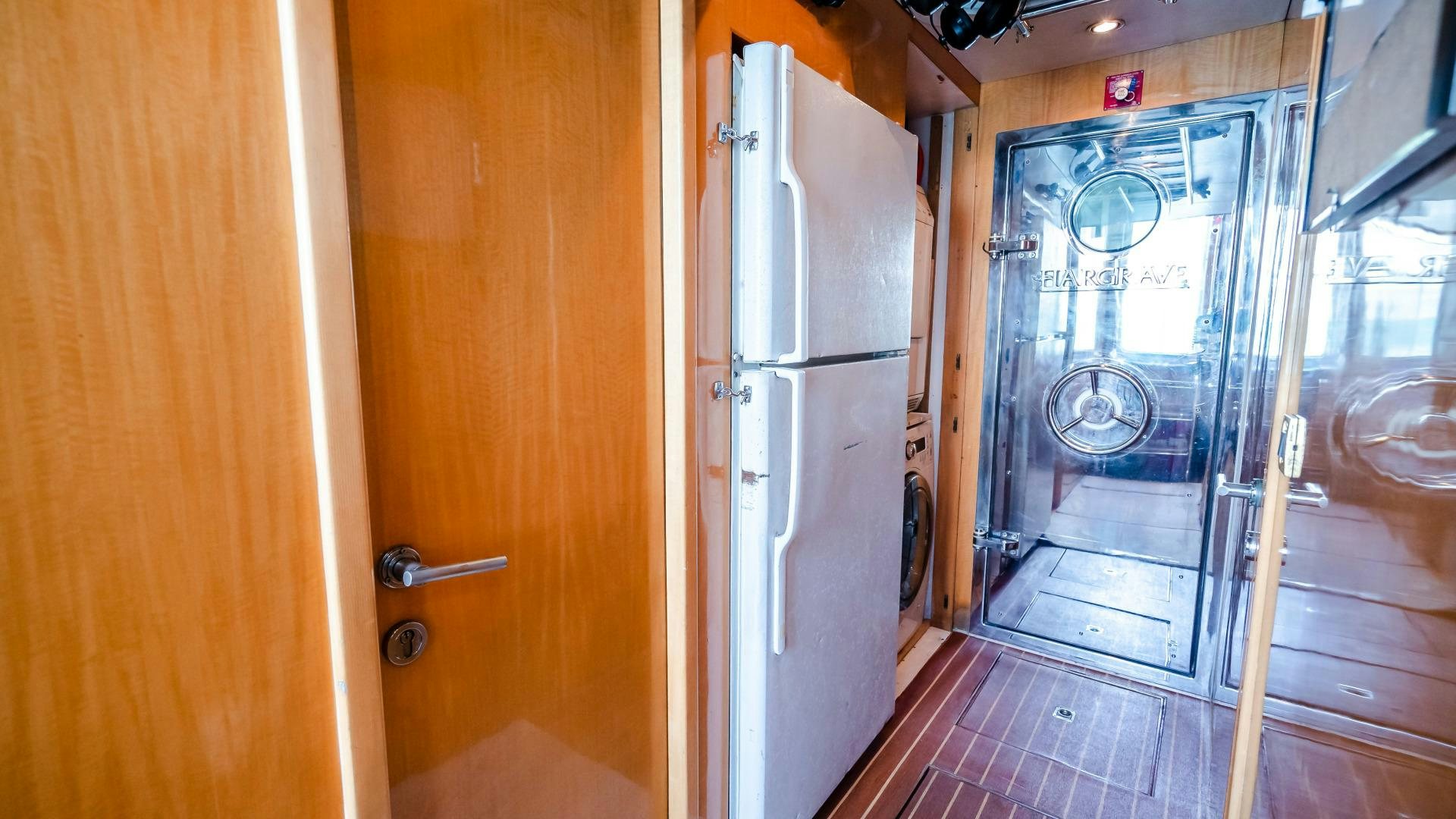 a kitchen with a glass door aboard VITESSE Yacht for Sale