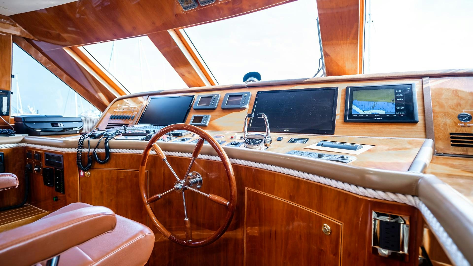 a wooden boat with a large wooden steering wheel and a large wooden steering wheel aboard VITESSE Yacht for Sale