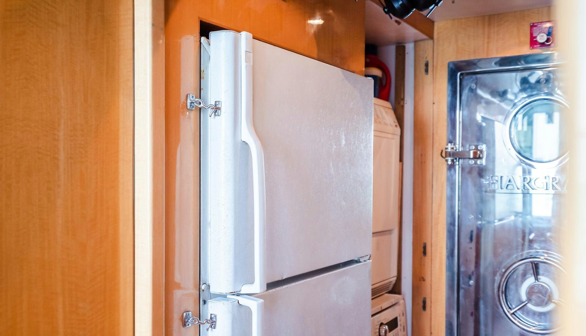 a refrigerator in a kitchen aboard VITESSE Yacht for Sale