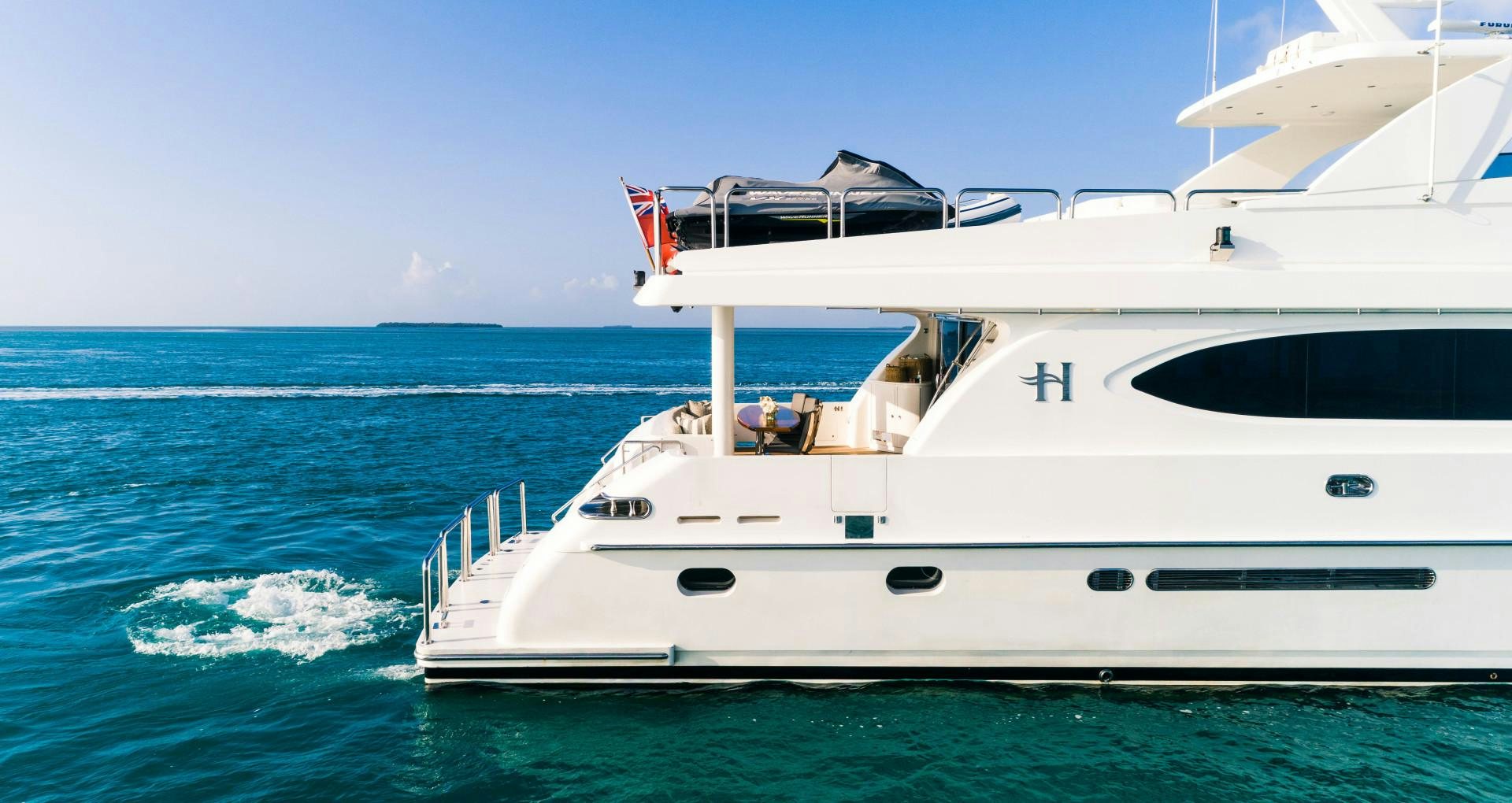 a white yacht in the ocean aboard VITESSE Yacht for Sale