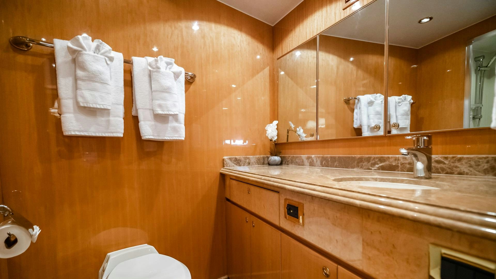 a bathroom with a large mirror aboard VITESSE Yacht for Sale