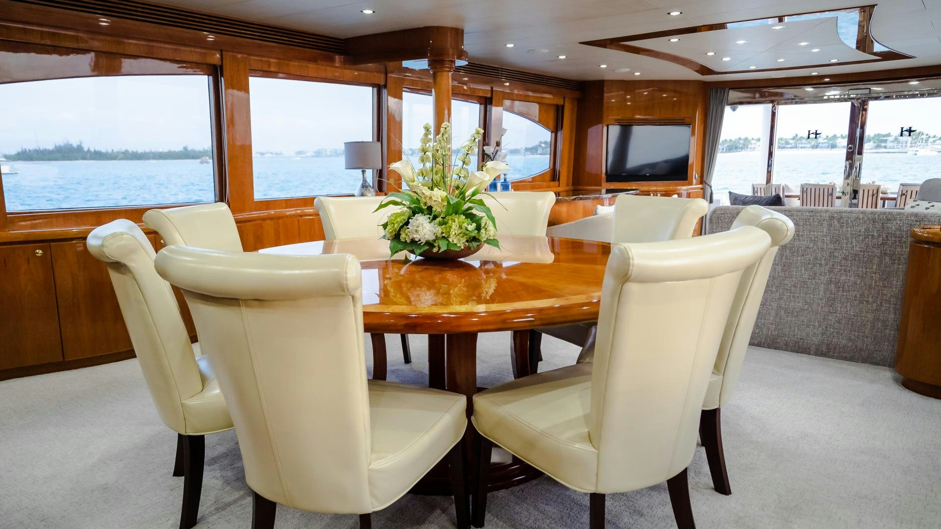 a room with a table and chairs aboard VITESSE Yacht for Sale