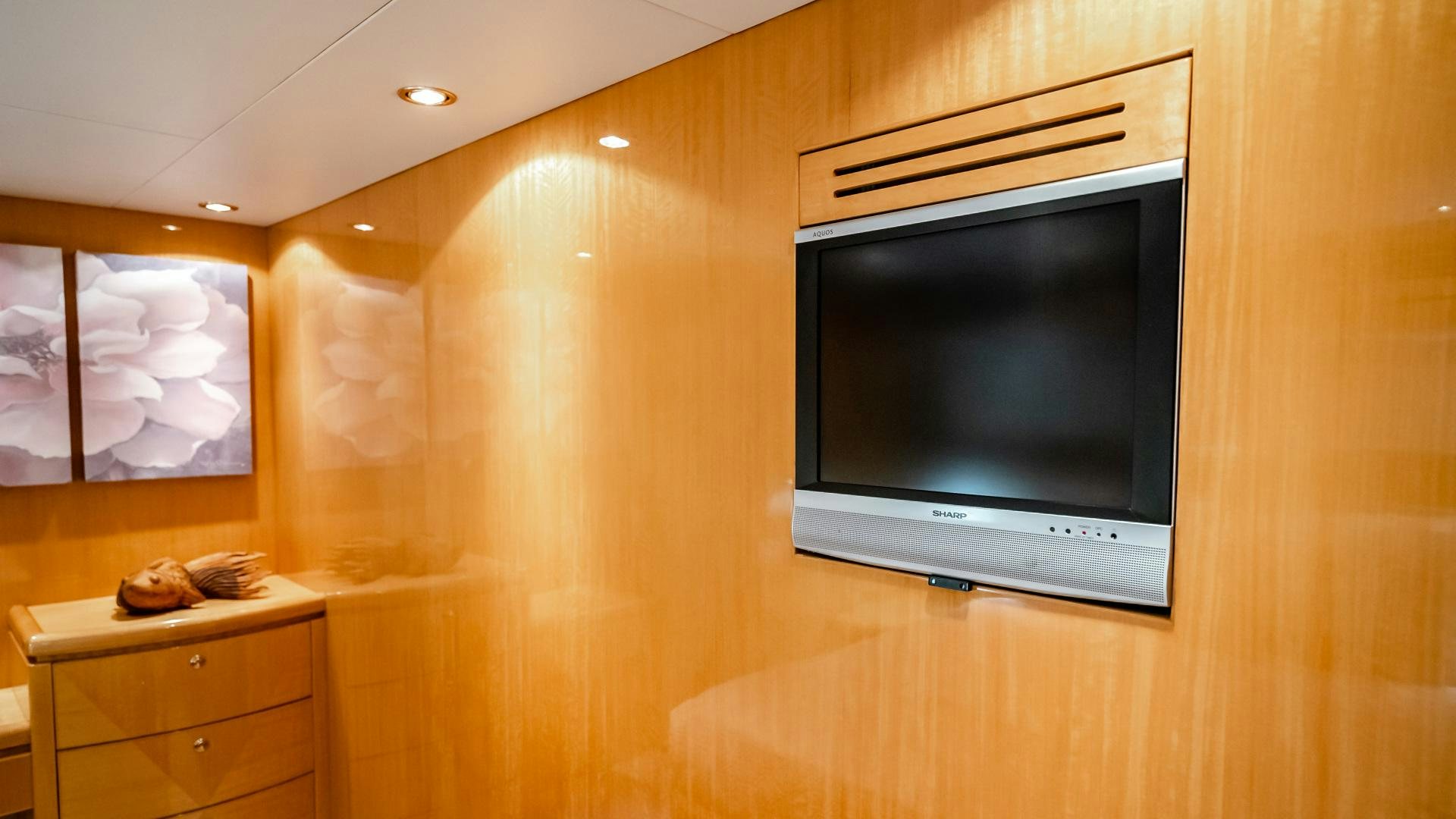 a tv on a wall aboard VITESSE Yacht for Sale