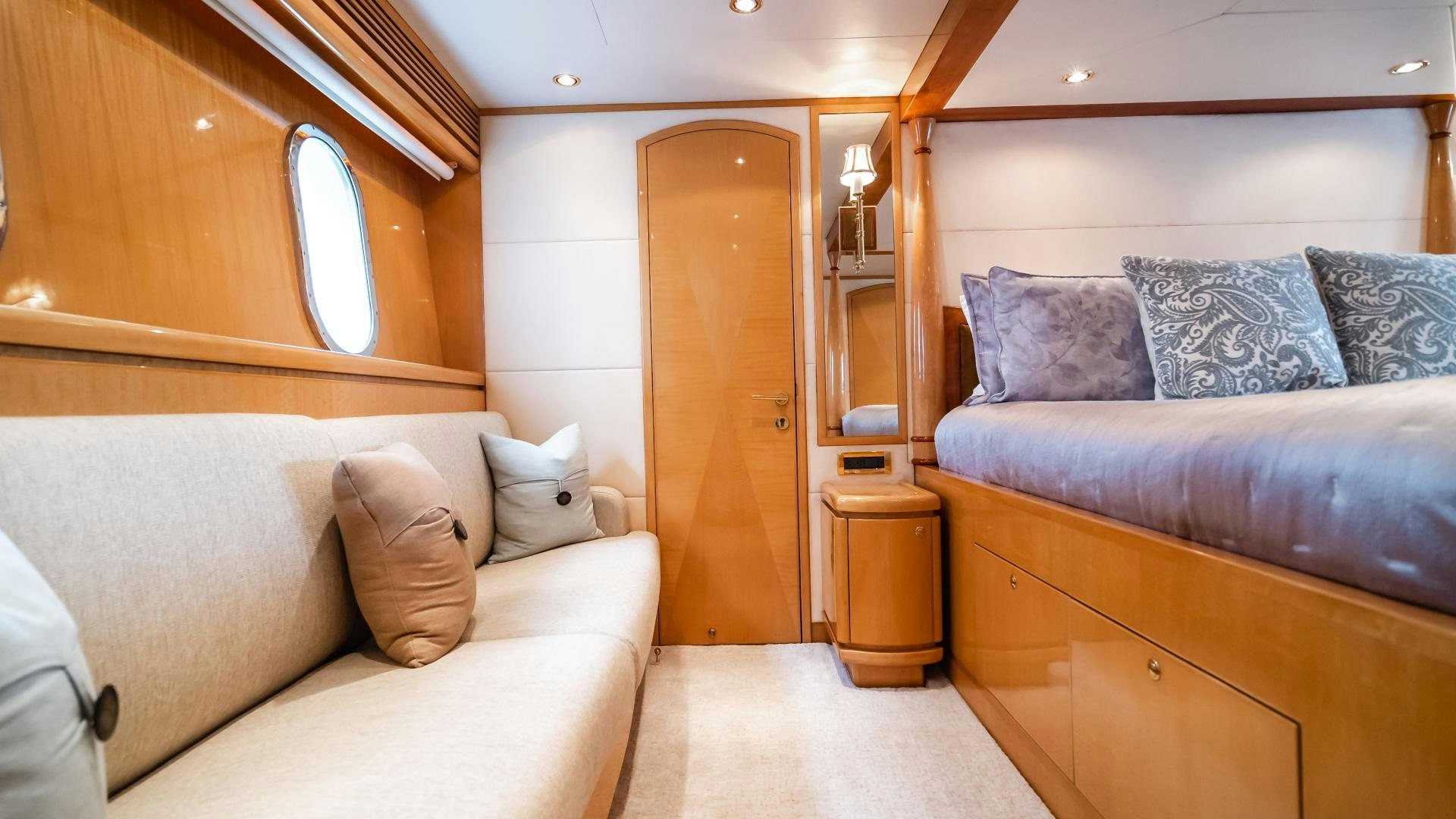 a living room with a couch and a wood door aboard VITESSE Yacht for Sale