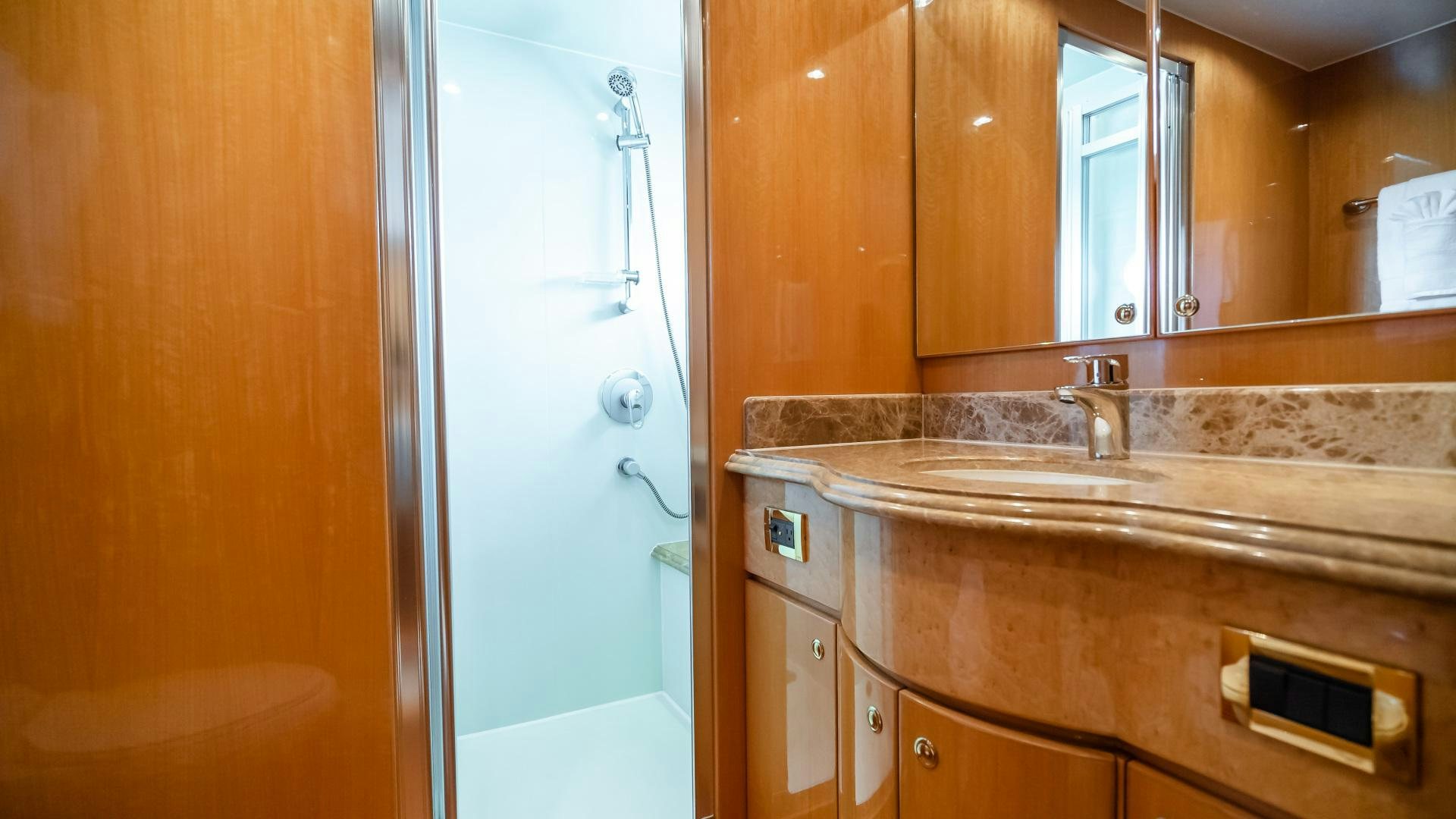 a bathroom with a countertop sink and a mirror aboard VITESSE Yacht for Sale