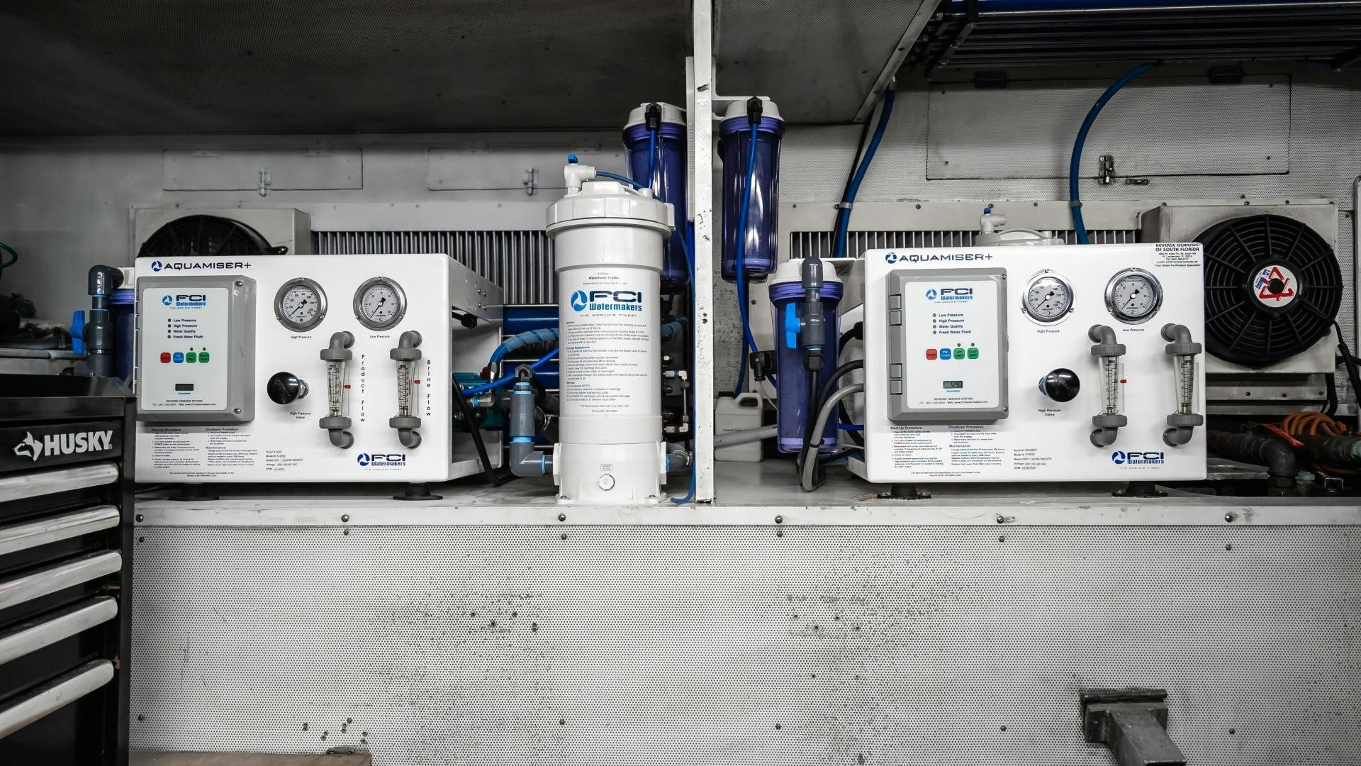 a white machine with a blue liquid in it aboard VITESSE Yacht for Sale