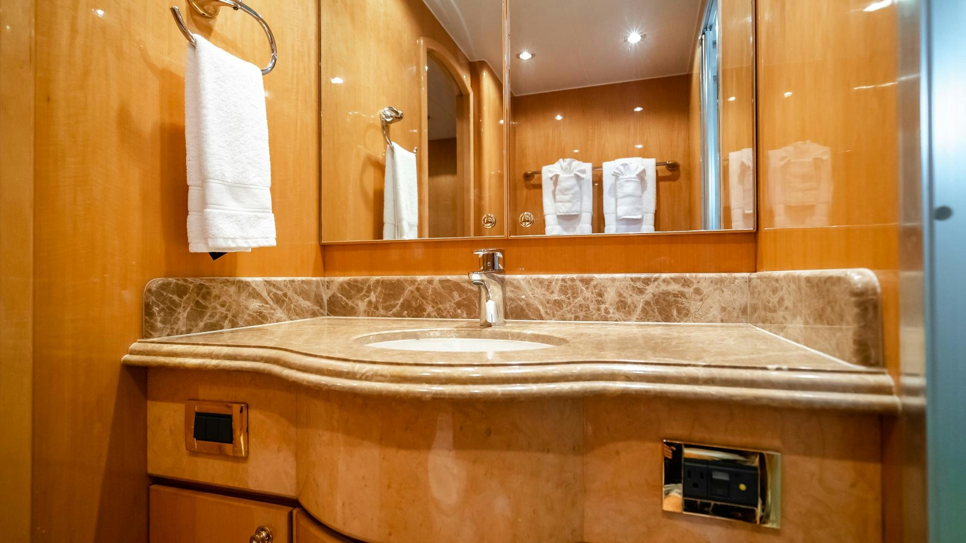 a bathroom with a sink and a mirror aboard VITESSE Yacht for Sale