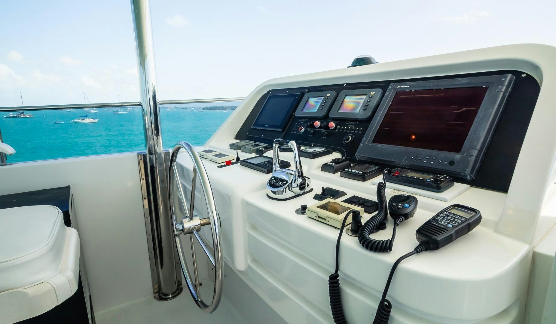 a boat with a tv and a steering wheel aboard VITESSE Yacht for Sale