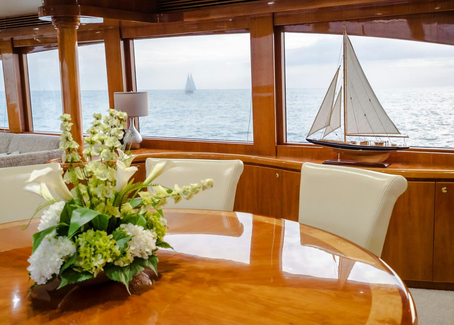 a table with a flower arrangement aboard VITESSE Yacht for Sale