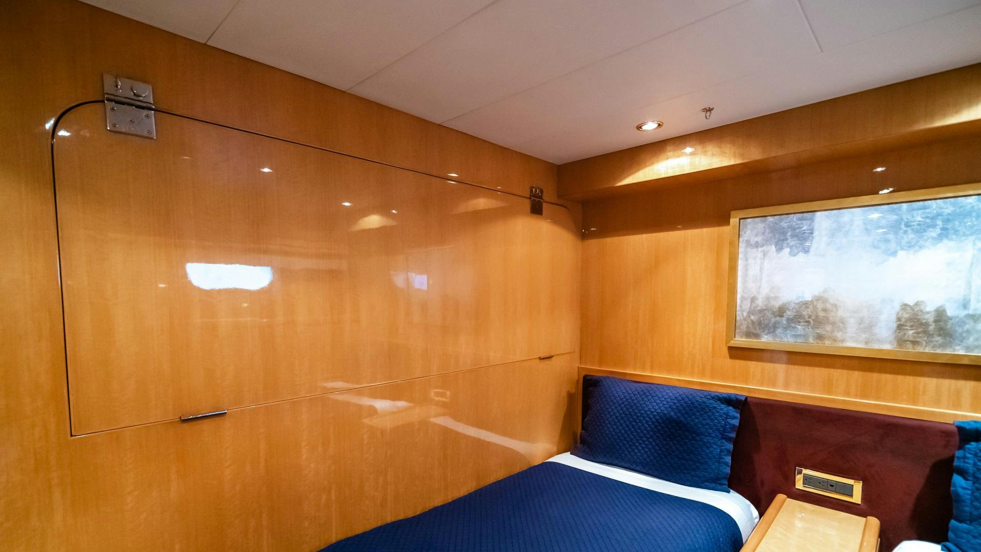 a room with a bed and a window aboard VITESSE Yacht for Sale