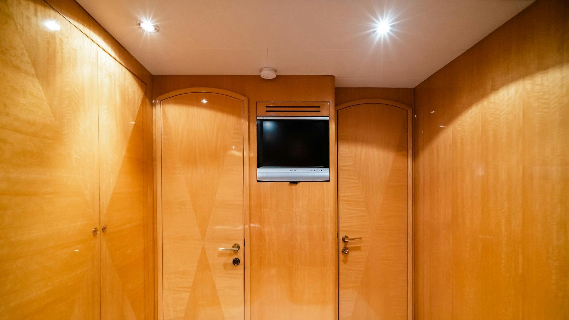 a room with wooden cabinets aboard VITESSE Yacht for Sale