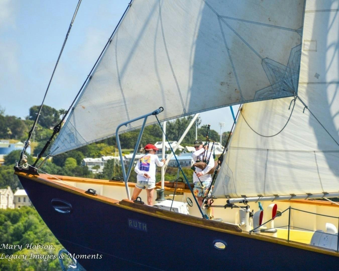 a couple of men on a sailboat aboard SCHOONER RUTH Yacht for Sale