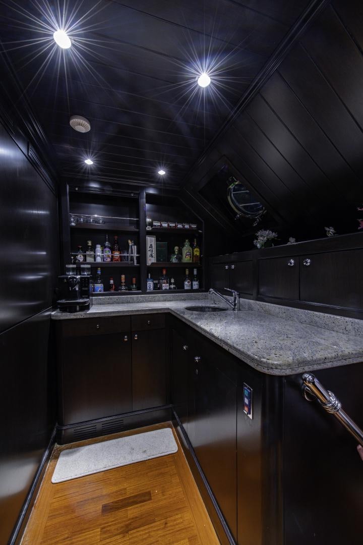 a kitchen with a bar and a bar aboard RUTLI E Yacht for Sale