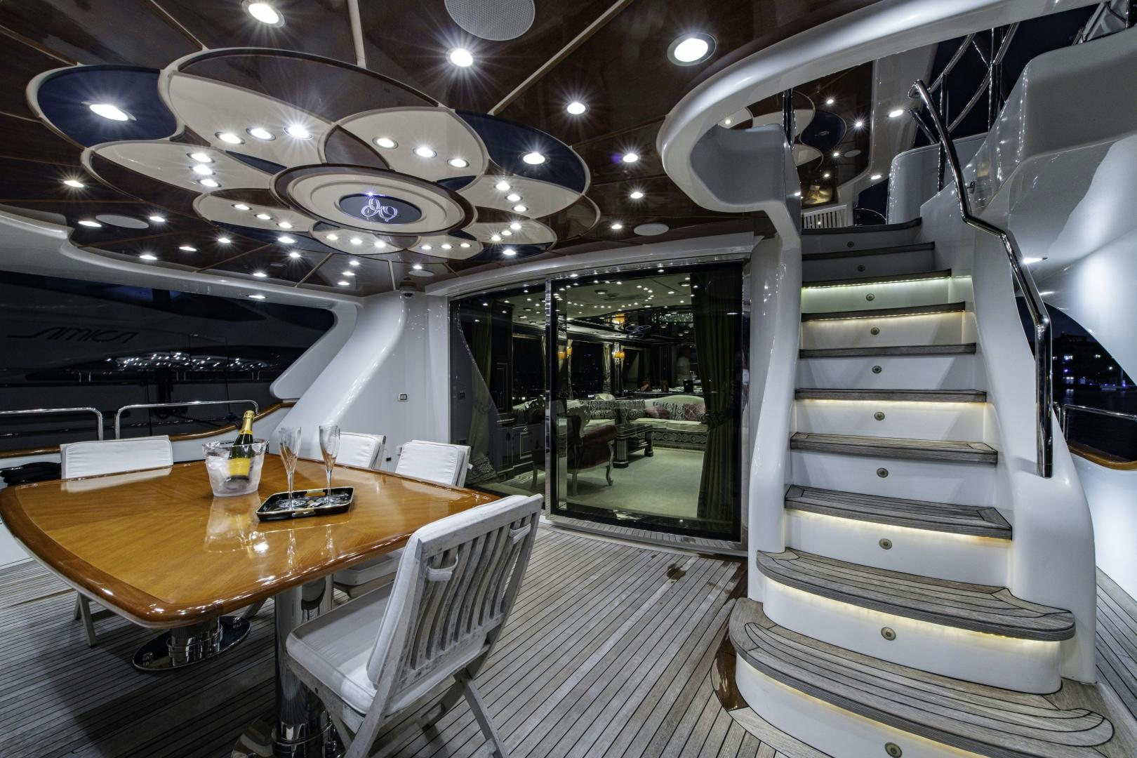 a room with a table and chairs aboard RUTLI E Yacht for Sale