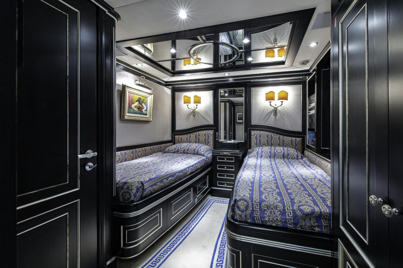 a bedroom with a double bed aboard RUTLI E Yacht for Sale