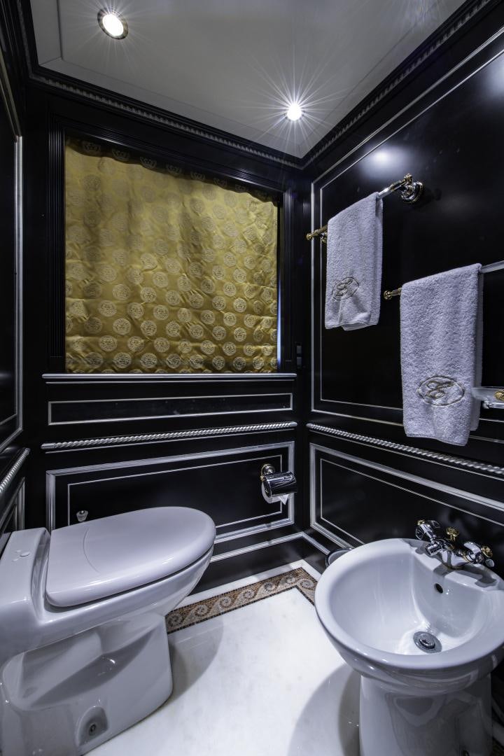 a bathroom with a toilet and sink aboard RUTLI E Yacht for Sale