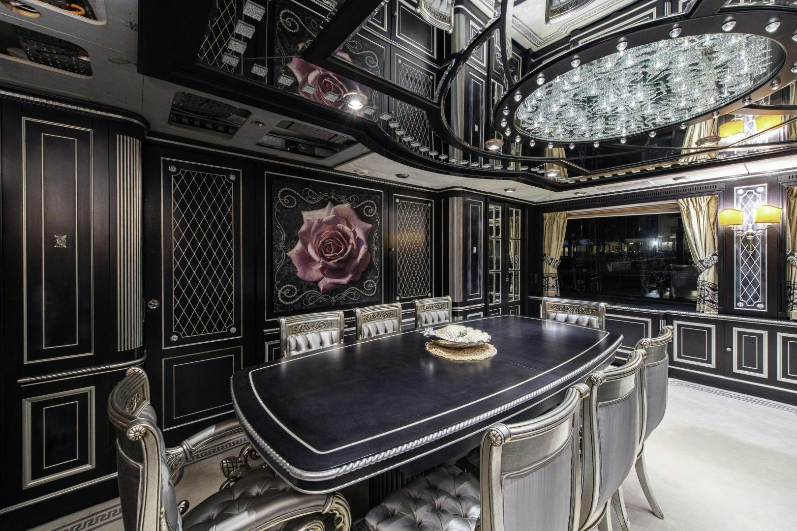 a dining room with a table and chairs aboard RUTLI E Yacht for Sale