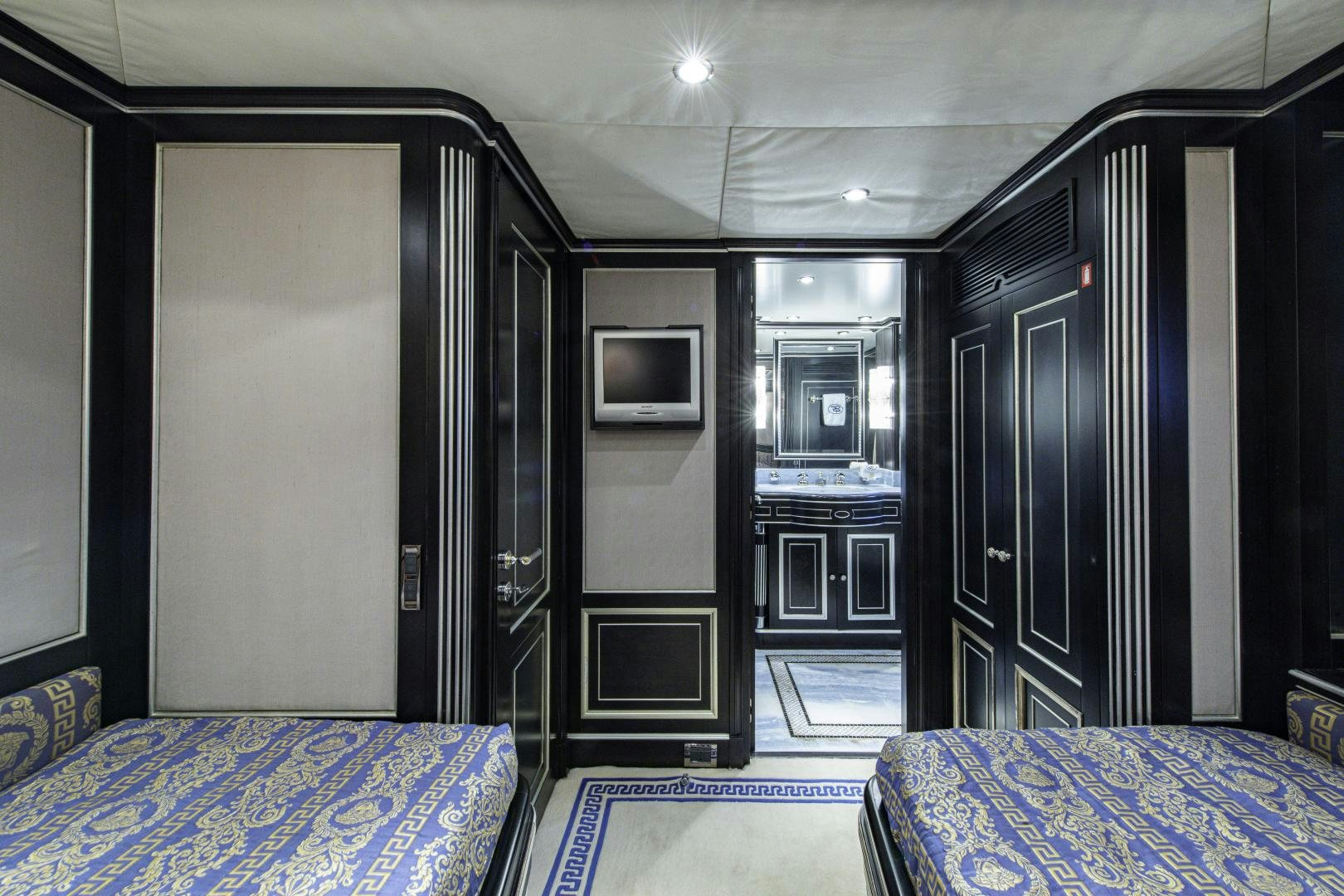 a room with a bed and a tv aboard RUTLI E Yacht for Sale