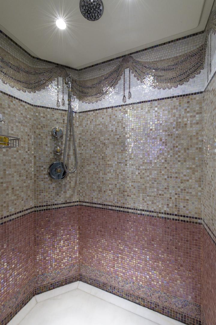 a shower with a tile wall aboard RUTLI E Yacht for Sale