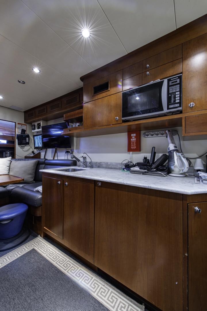 a kitchen with a microwave oven aboard RUTLI E Yacht for Sale