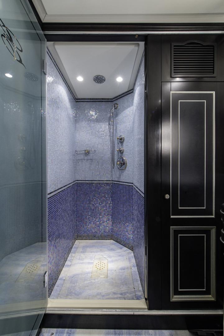 a blue tiled room aboard RUTLI E Yacht for Sale