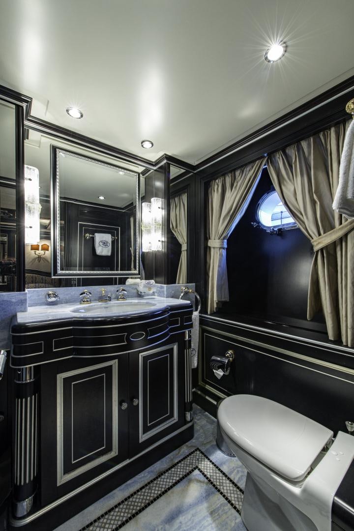 a bathroom with a large mirror aboard RUTLI E Yacht for Sale