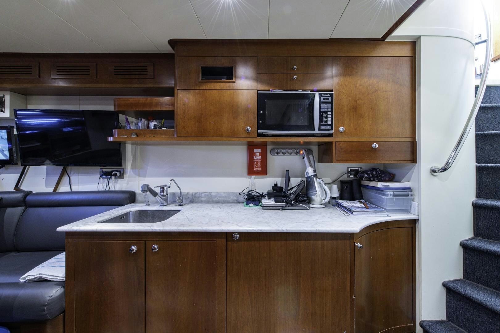 a kitchen with a microwave oven aboard RUTLI E Yacht for Sale