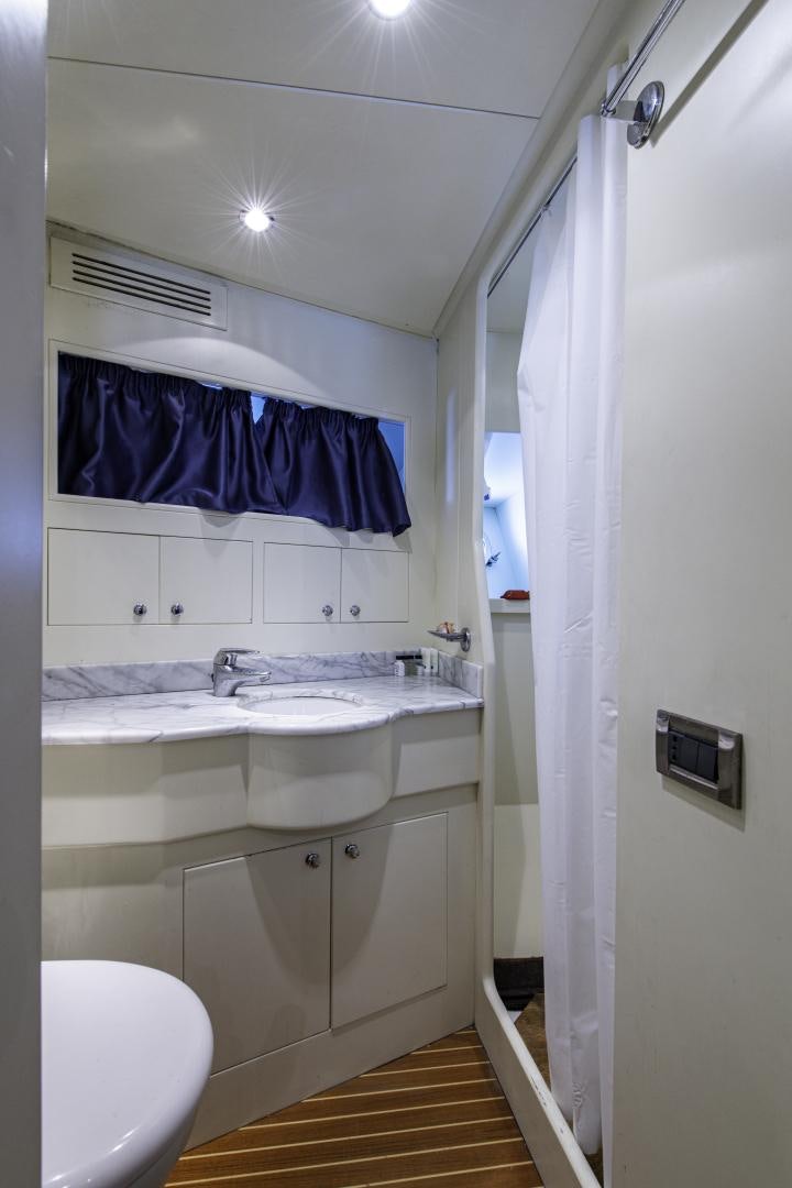 a bathroom with a sink and a toilet aboard RUTLI E Yacht for Sale