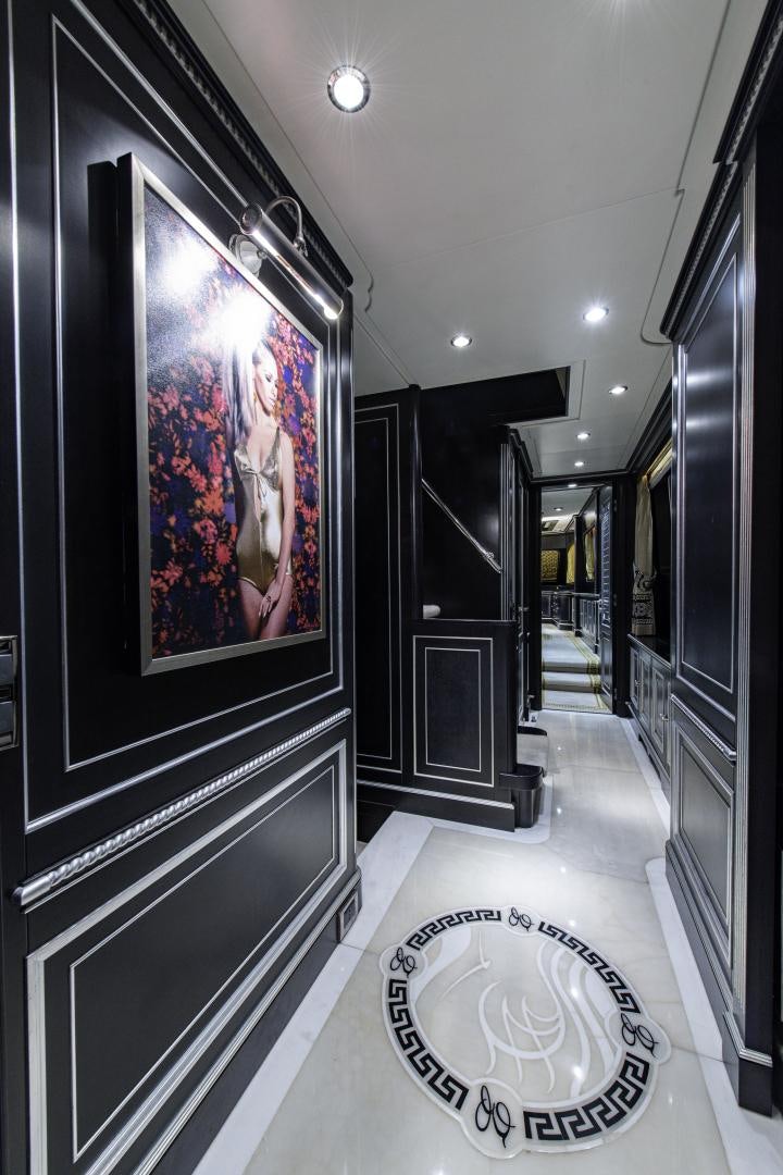 a hallway with a painting on the wall aboard RUTLI E Yacht for Sale