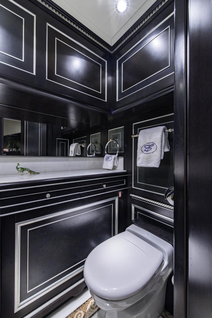 a bathroom with a toilet and a sink aboard RUTLI E Yacht for Sale