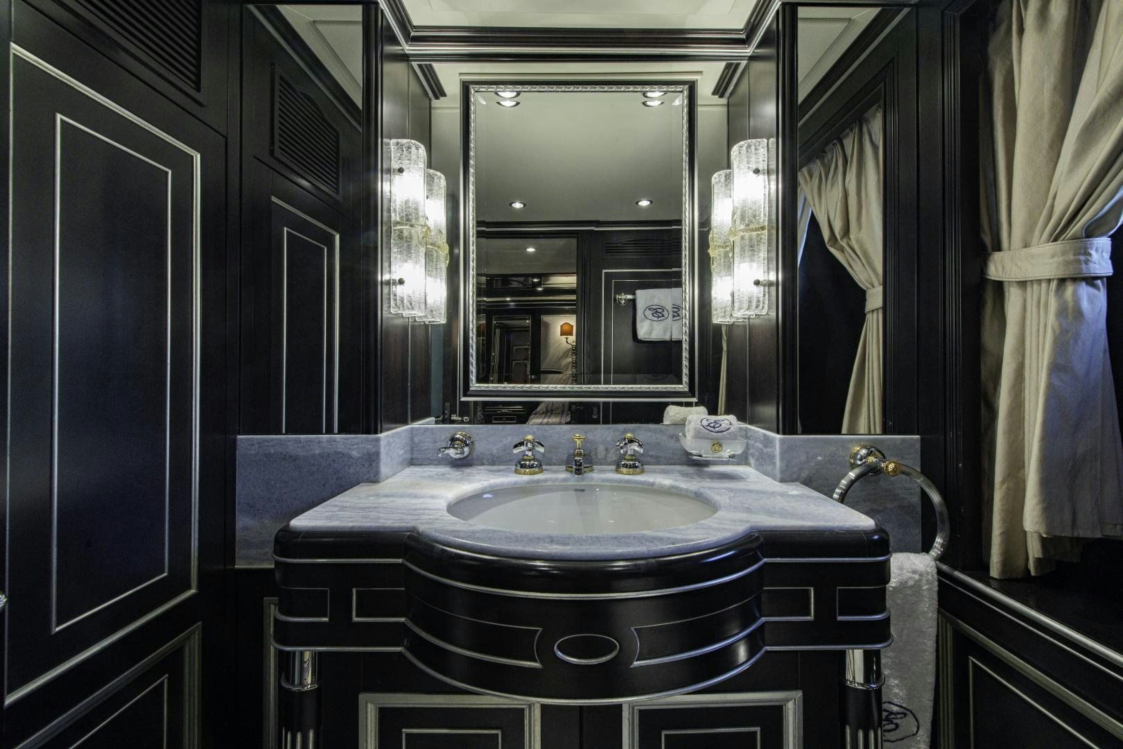 a bathroom with a large mirror aboard RUTLI E Yacht for Sale