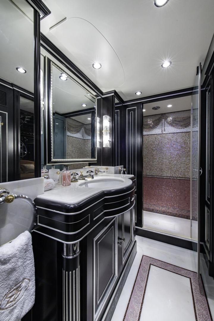 a bathroom with a large mirror aboard RUTLI E Yacht for Sale